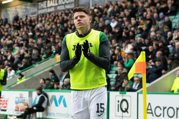 Kevin Nisbet applauds the fans as he warms up during Hibs' 6-0 victory over Aberdeen