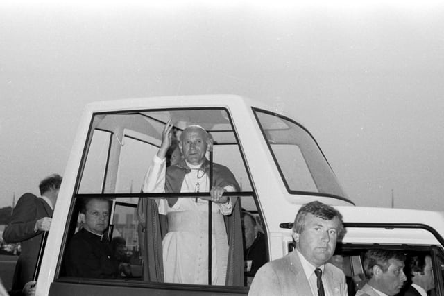 Pope John Paul II waves to the Murrayfield crowd from the Popemobile.