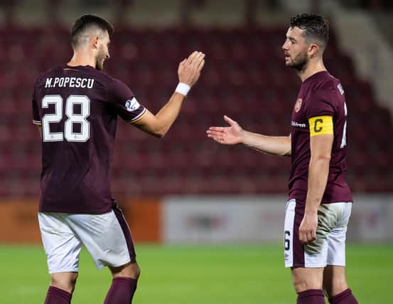 Hearts centre-backs Mihai Popescu and Craig Halkett are still buidling a relationship at the back. Picture: SNS