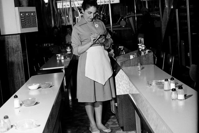 Waitresses uniforms -Blue-grey Bri-Nylon with pale lemon apron at South Charlotte Street's Pied Piper cafe, which was a favourite in Edinburgh for many years.