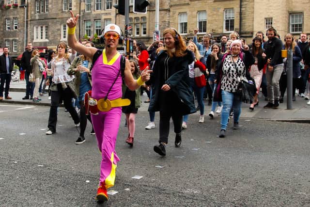 A silent disco walking tour in the Grassmarket during the 2017 Fringe