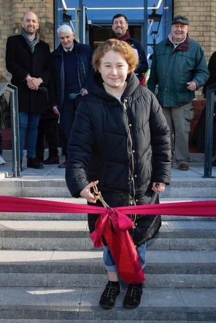 Summer Urquhart S3 pupil at Craigroyston Community High School cutting the ribbon opening the Square.