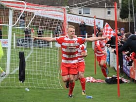 Keiran McGachie wheels away in celebration after netting the winner against Stranraer. Picture: Joe Gilhooley LRPS.