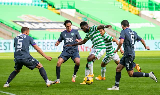 The Hibs defence keeps Odsonne Edouard at bay as the Celtic striker looks for a route to goal