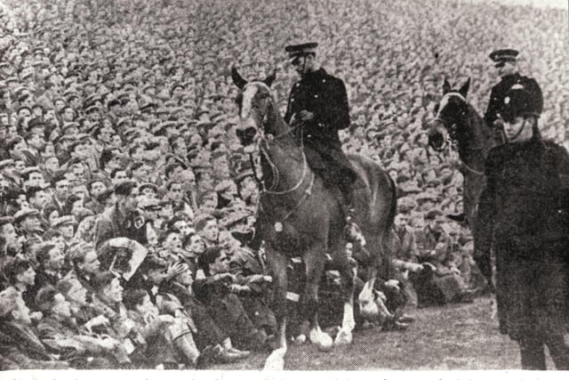 Mounted police keep an eye on the crowds at Easter Road after a 'break in' at an Edinburgh Derby in January 1950. A record attendance of more than 65,000 fans saw Hearts win the match 1-2.