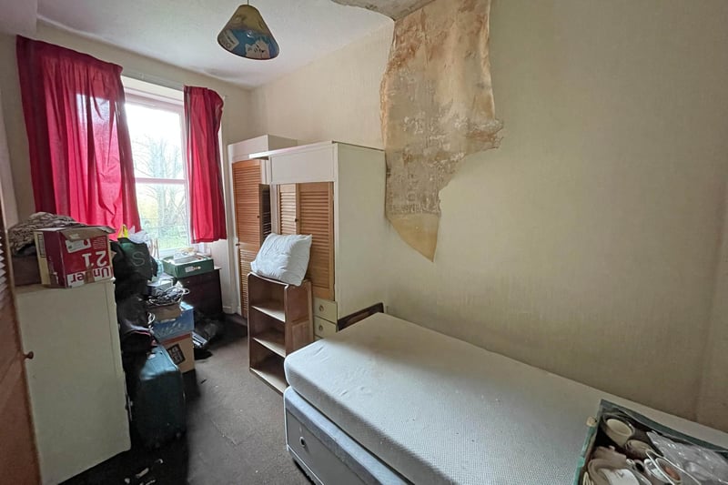 The bedroom has a window overlooking the rear, and there is a storage cupboard. The flat also features double glazing.