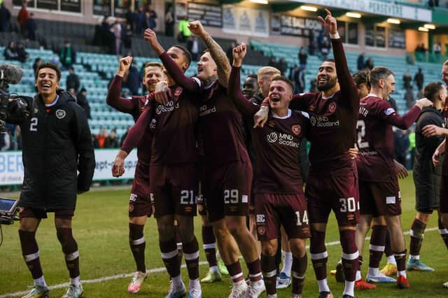 Hearts players celebrate after beating Hibs 3-0 at Easter Road.