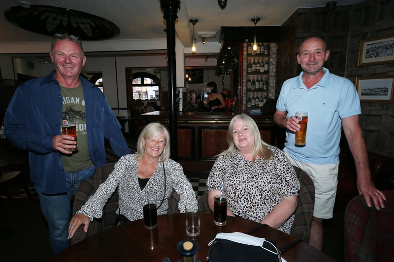 From left, Terry Paige, Marie Bell, and Lorraine and Ian Stobbs. Fans watch England v Ukraine in the quarter finals of Euro 2020, in The Kings pub, Albert Rd, Southsea. Picture: Chris Moorhouse (jpns 030721-16)