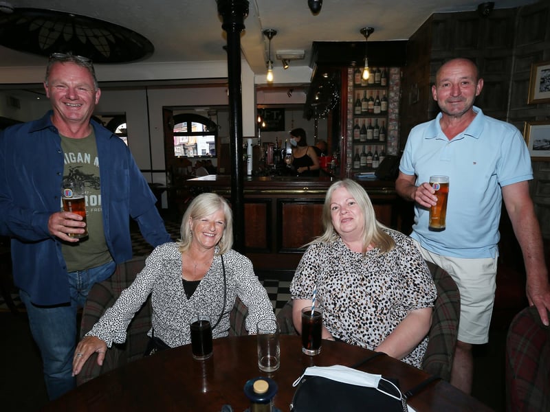 From left, Terry Paige, Marie Bell, and Lorraine and Ian Stobbs. Fans watch England v Ukraine in the quarter finals of Euro 2020, in The Kings pub, Albert Rd, Southsea. Picture: Chris Moorhouse (jpns 030721-16)