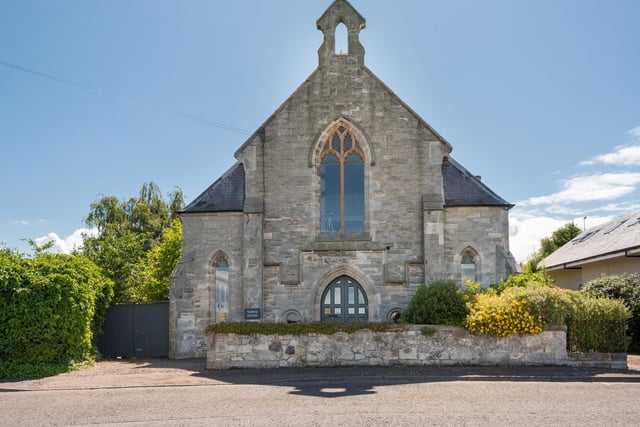 The converted church retains many original features including bespoke windows and doors