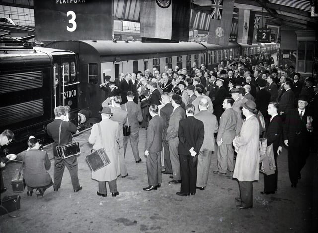 Excitement at Sheffield Victoria Station as the first electric train arrives at the inauguration of the electric rail line on September 14, 1954