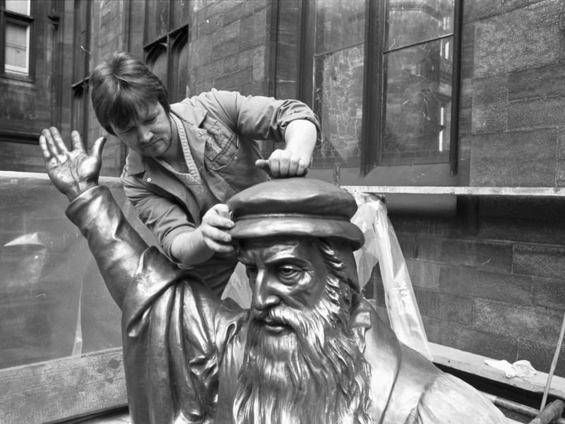 David Ferguson gives the statue of Scottish religious reformer John Knox a spring clean in April 1982.