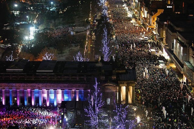 New Year revellers can be seen here gathering on Princes Street on 31 December 2009 - it was estimated that around 80,000 people attended the festivities in the capital.