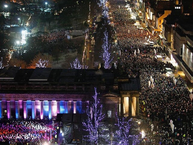 New Year revellers can be seen here gathering on Princes Street on 31 December 2009 - it was estimated that around 80,000 people attended the festivities in the capital.
