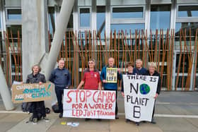 Climate change activists gathered outside the Scottish Parliament on Friday to protest against the development of a controversial new Cambo oil field.
