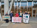 Climate change activists gathered outside the Scottish Parliament on Friday to protest against the development of a controversial new Cambo oil field.