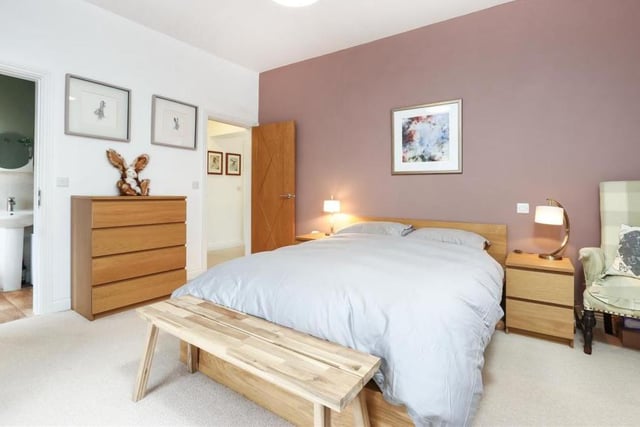 All three bedrooms are of a similar size, although this is considered to be the main one. Bright and comfortable. it boasts an en suite shower room to the left.