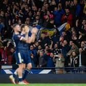 Scotland players applaud the fans at full time during a FIFA World Cup Qualifier between Scotland and Denmark. Future games will be streamed on a new service from 2024. (Photo by Craig Foy / SNS Group)