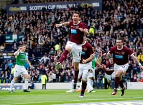 Ryan McGowan roars with delight after scoring his side's fourth goal of the game as Hearts defeated Hibs in the 2012 Scottish Cup final. Picture: SNS
