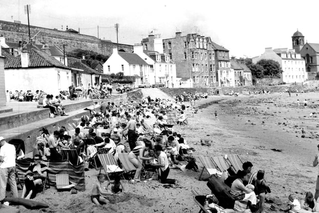 Holidaymakers enjoying the heat on the beach at Kinghorn in Fife in July 1966.