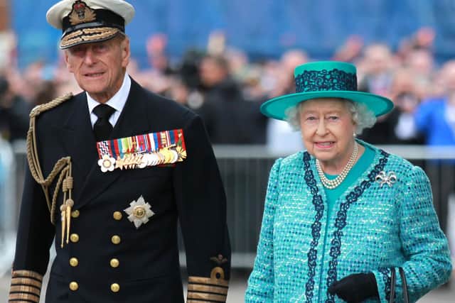 Queen Elizabeth II and the Duke of Edinburgh at the formal naming ceremony for HMS Queen Elizabeth in Rosyth Dockyard, Fife.