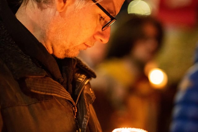 A man holds a candle outside The Filmhouse during Wednesday night's vigil on Lothian Road in Edinburgh. Copyright James Armandary Photography
