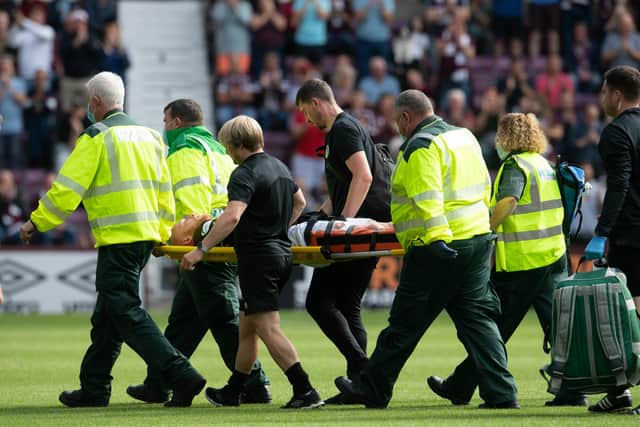 Liam Boyce is stretchered off in first-half injury time. Picture: Ross Parker / SNS
