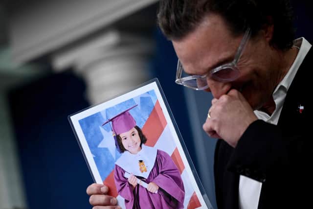 US actor Matthew McConaughey holds a photo of Alithia Ramirez, a 10 year old student who was killed in the mass shooting at Robb Elementary School, while speaking during the daily briefing in the James S Brady Press Briefing Room of the White House in Washington, DC, on June 7, 2022. Photo by Brendan SMIALOWSKI via Getty)