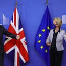 Boris Johnson is welcomed by European Commission President Ursula von der Leyen in the Berlaymont building at the EU headquarters in Brussels