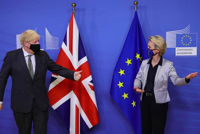 Boris Johnson is welcomed by European Commission President Ursula von der Leyen in the Berlaymont building at the EU headquarters in Brussels