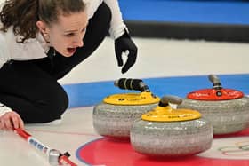 Jenn Dodds curls the stone during the final mixed doubles round robin session ahead of the semi-final against Norway