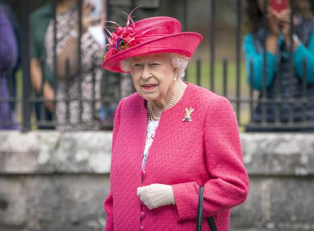 Queen Elizabeth II at the gates at Balmoral, as she takes up summer residence at the castle.