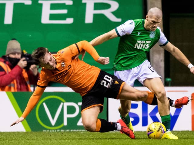 Alex Gogic tangles with Luke Bolton during Saturday's Scottish Premiership match between Hibs and Dundee United at Easter Road