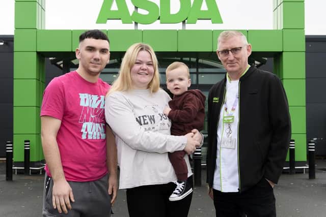 Toddler Finlay Allan with parents Beth and Jack and Asda first-aider James Jenkins