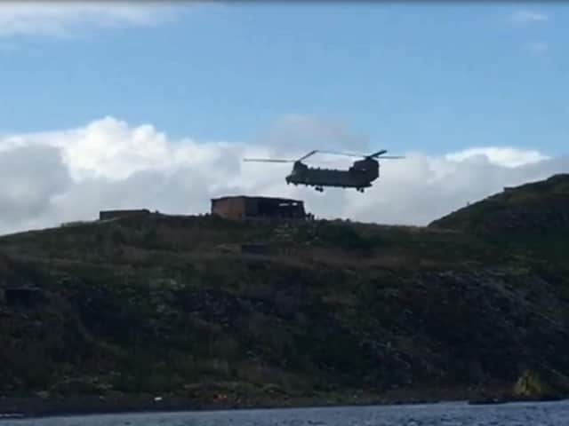 A Chinook lands on Inchkeith during military exercises.