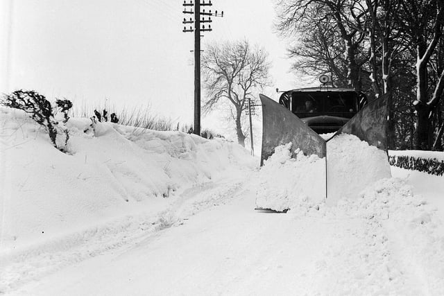 A snow plough in operation at Currie's Hermiston Road in February 1956.