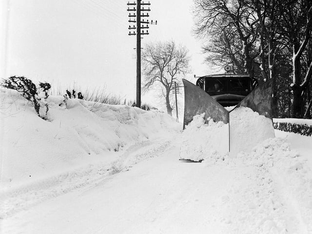 A snow plough in operation at Currie's Hermiston Road in February 1956.