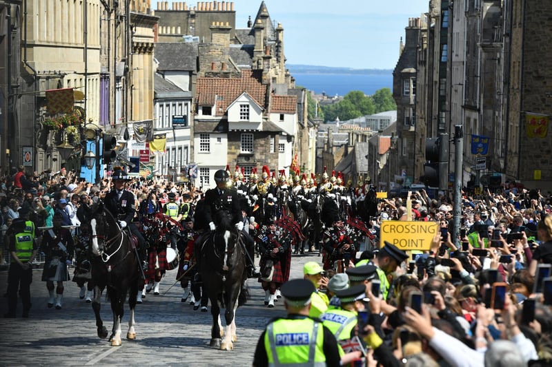 Mounted police officers in the procession up the Royal Mile to St Giles' Cathedral, Edinburgh, for the National Service of Thanksgiving and Dedication for King Charles III and Queen Camilla.
