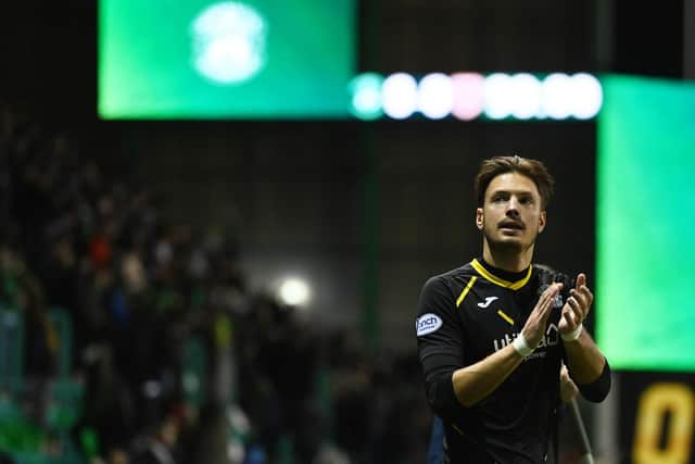 Kevin Dabrowski applauds the Hibs fans at full time