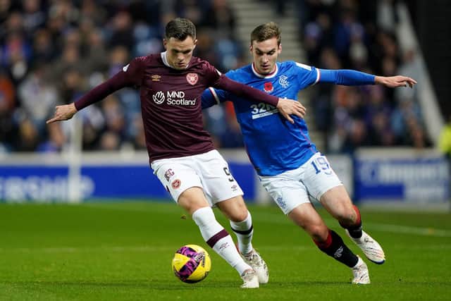 Robbie Neilson was pleased with the performance Lawrence Shankland, seen here holding off Rangers defender James Sands. Picture: Andrew Milligan/PA