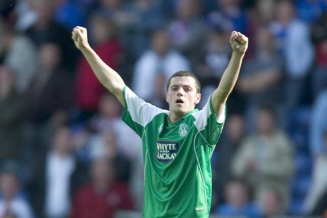 Ivan Sproule celebrates his hat-trick for Hibs against Rangers at Ibrox in August 2005