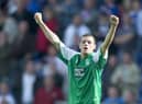 Ivan Sproule celebrates his hat-trick for Hibs against Rangers at Ibrox in August 2005