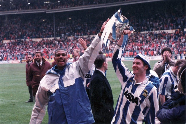 Carlton Palmer and John Sheridan celebrate their side's Rumbelows Cup win in April 1991.