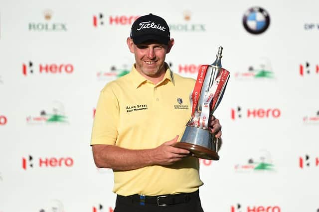 Stephen Gallacher holds his trophy after his most recent European Tour win in the 2019 Hero Indian Open in New Delhi. Picture: Money Sharma/AFP via Getty Images.