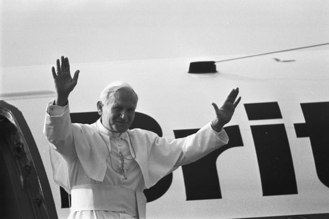 Pope John Paul II waves to the crowd before he boards his helicopter at Turnhouse at the end of the Papal visit to Scotland.