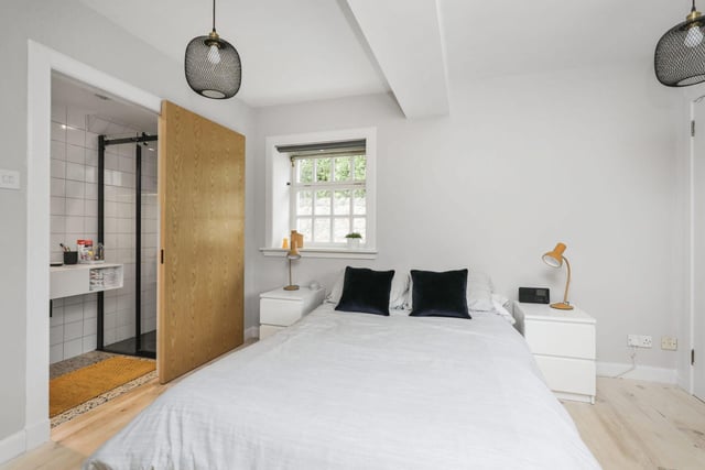 Located on the ground floor is the master bedroom with beautiful natural light from the dual aspect windows, wooden flooring, built in storage and sliding door giving access to the modern en-suite shower room.