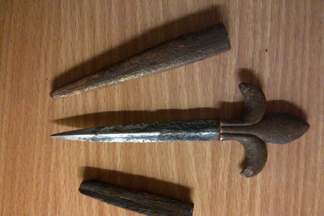 The scabbard, knife and leather insert were unearthed at Deanburn woods, Penicuik