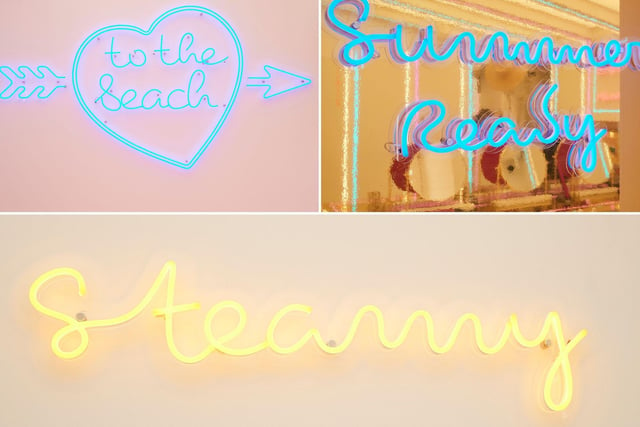 This is honestly just a sampling of the neon signs set up throughout the villa. See how many you spot in the first episode!