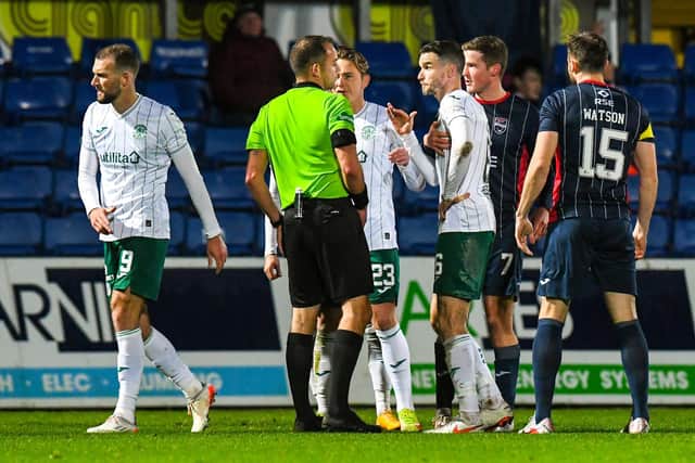 DINGWALL, SCOTLAND - NOVEMBER 24: Hibs Christian Doidge walks off after being shown a red card during a cinch Premiership match between Ross County and Hibernian at The Global Energy Stadium, on November 24, 2021, in Glasgow, Scotland. (Photo by Ross MacDonald / SNS Group)