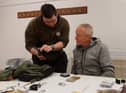 Jason Rennie, chairman of West Lothian Angling Association (left) discusses a point with Scot (cor) Muir at the club's monthly fly tying session. Picture Nigel Duncan